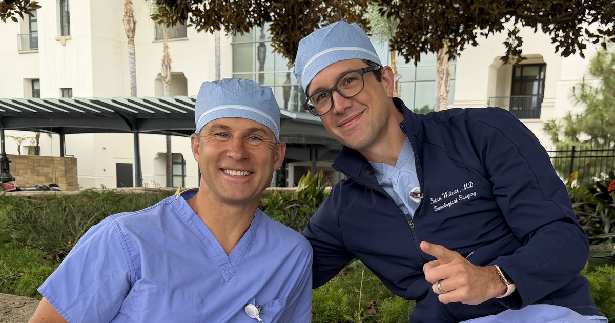 Dr. Brian Walcott and physician assistant David Barsky in surgical caps outside Santa Barbara Cottage Hospital